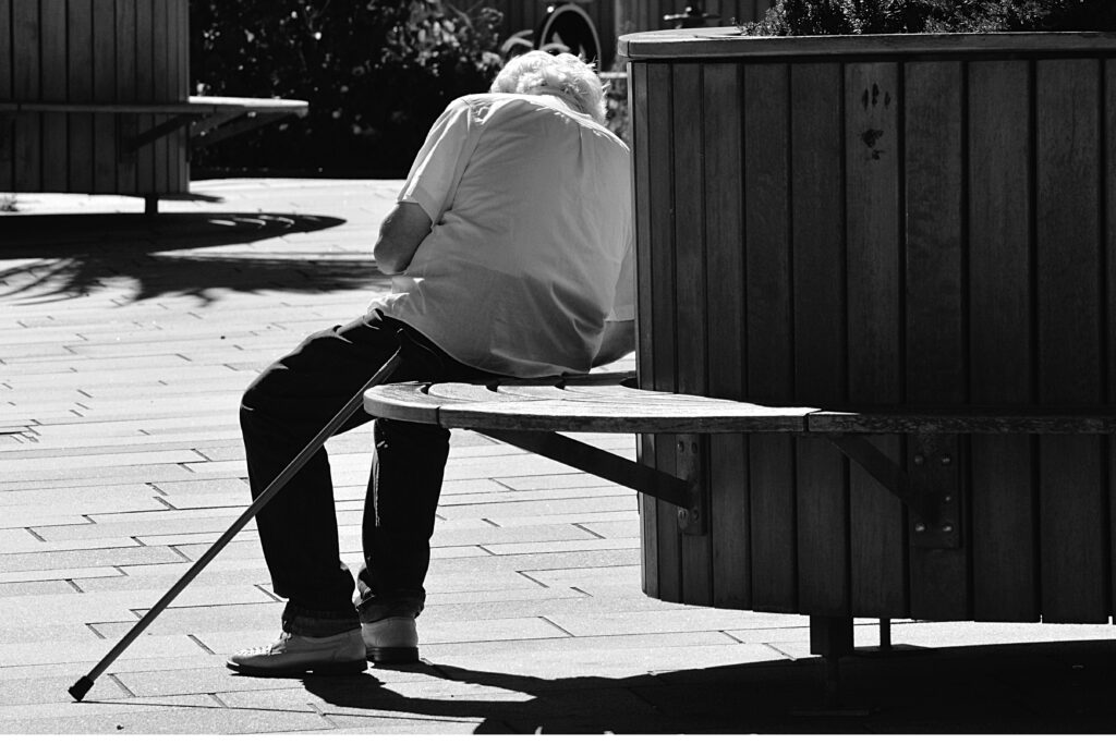 senior with cane, fall risk, sign to talk about assisted living